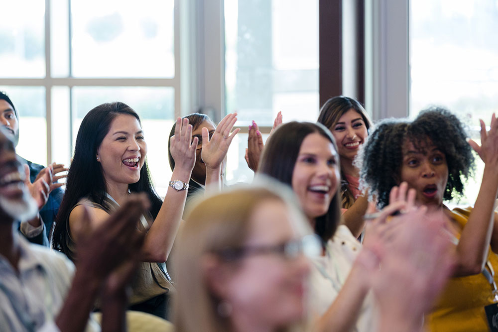 women clapping