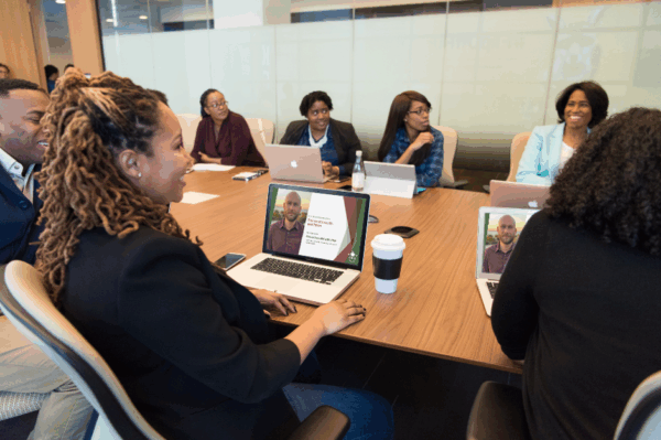 People in a conference room attending a watch party.